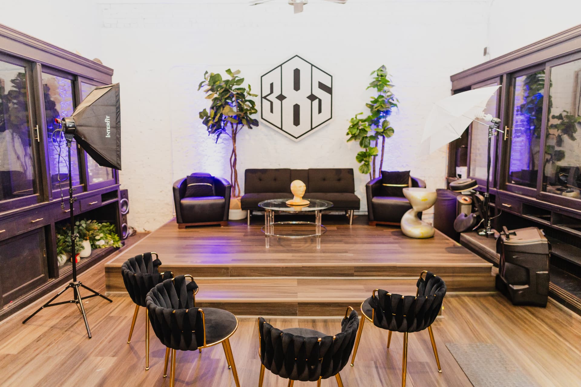 The 385 logo above the raised stage lounge seating at District385