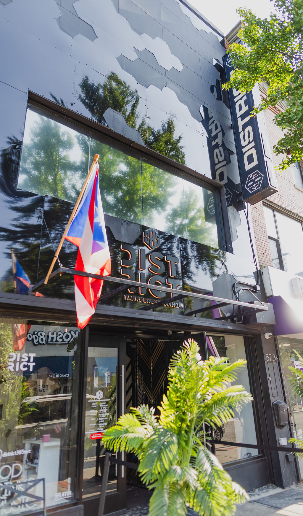 Daytime view of the District385 storefront and signage