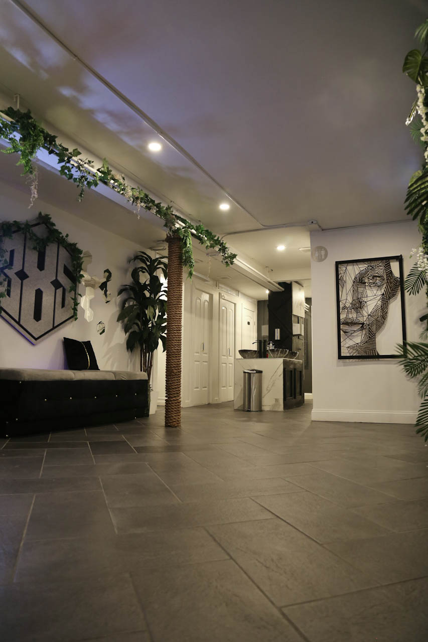 The bright entry hallway and lounge seating inside District385