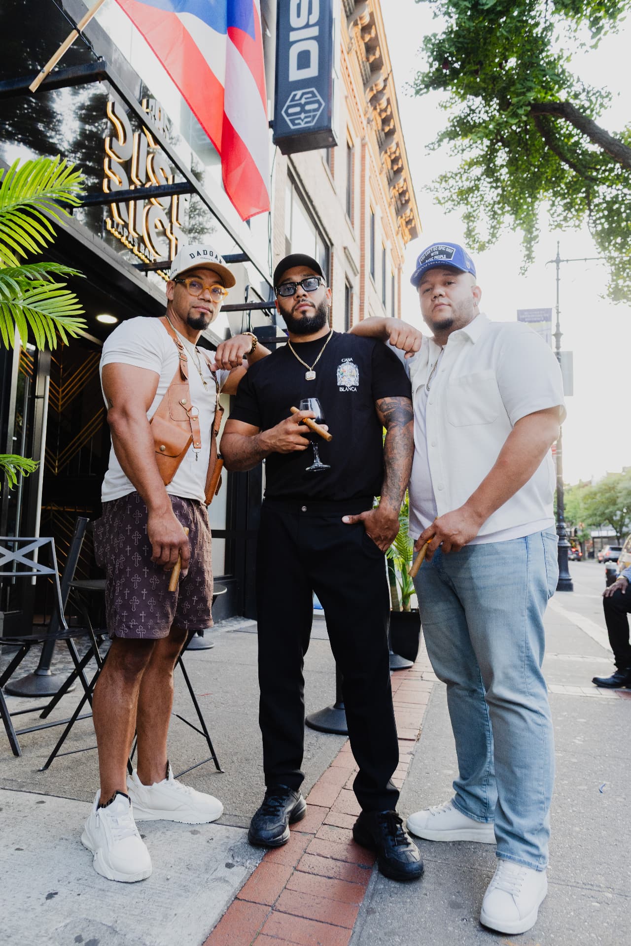 The District385 founders outside the Myrtle Avenue storefront in Ridgewood, Queens